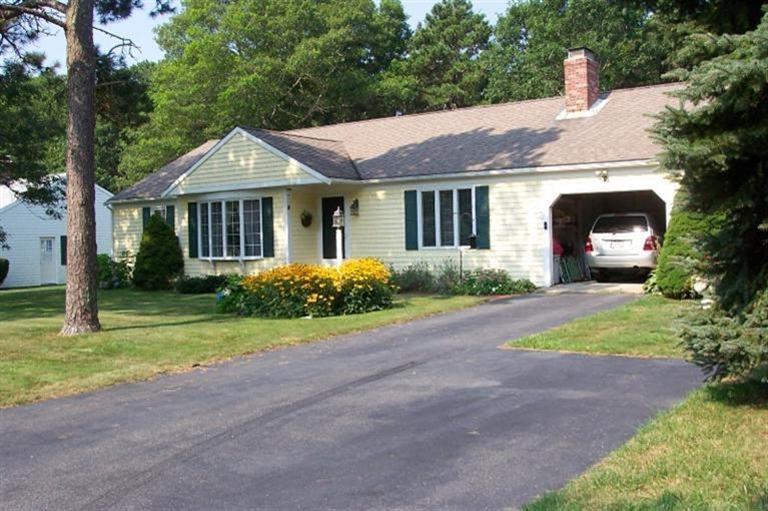 101 Ansel Howland Road Centerville, MA 02632 - Photo 3 of 23 a front view of a house with garden