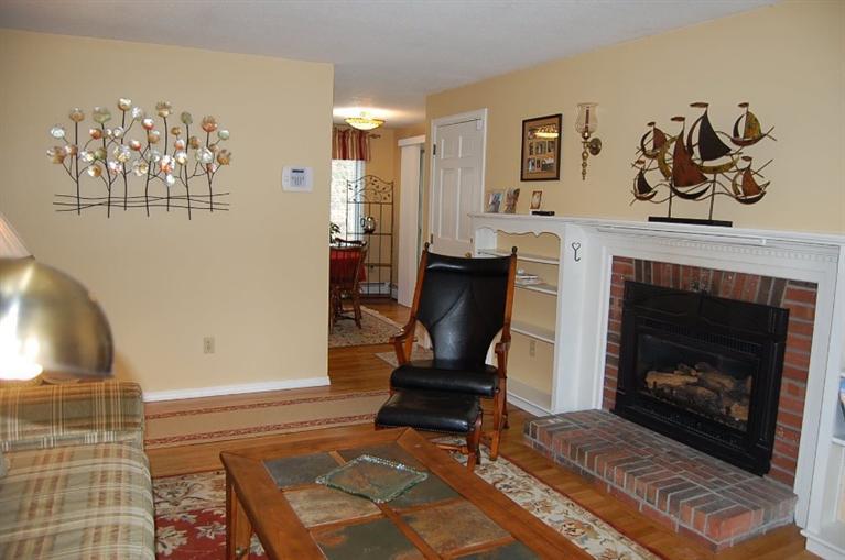 101 Ansel Howland Road Centerville, MA 02632 - Photo 9 of 23 a living room with furniture and a fireplace