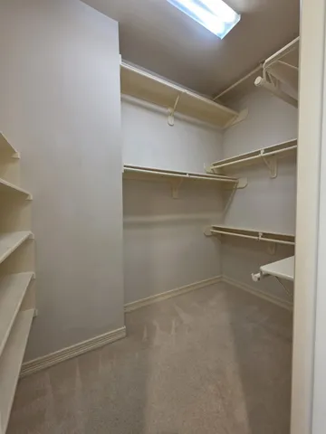 a view of an empty walk in closet