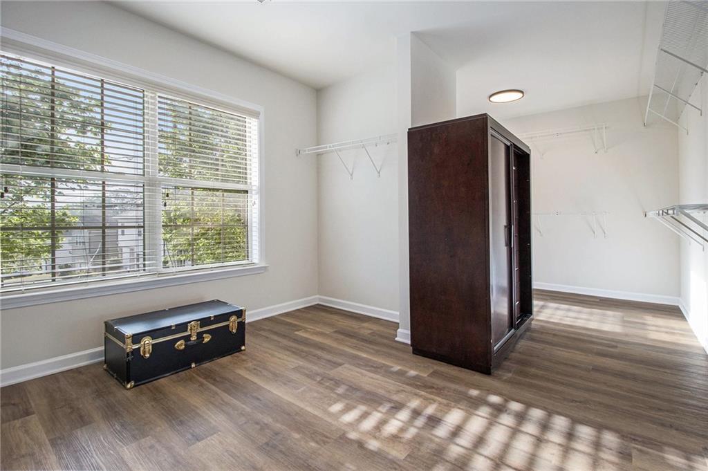 218 Third Avenue Avondale Estates, GA 30002 - Photo 23 of 26 a living room with a window and a wooden floor