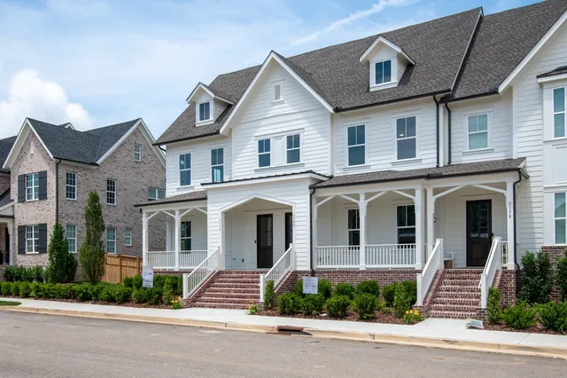 a view of a house with a door and wooden floor