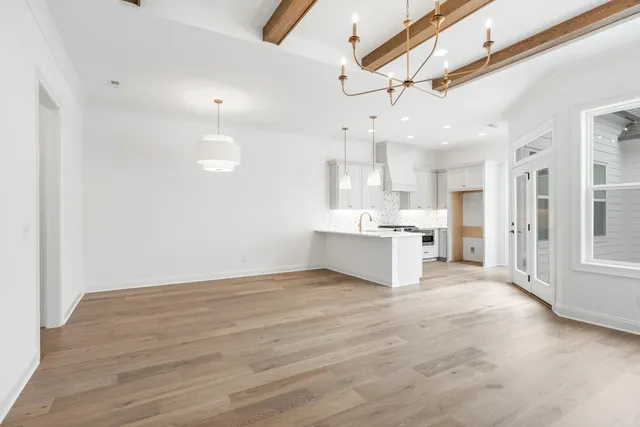 a kitchen with a sink stainless steel appliances and cabinets