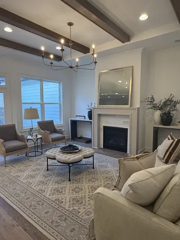a kitchen with kitchen island a dining table and chairs