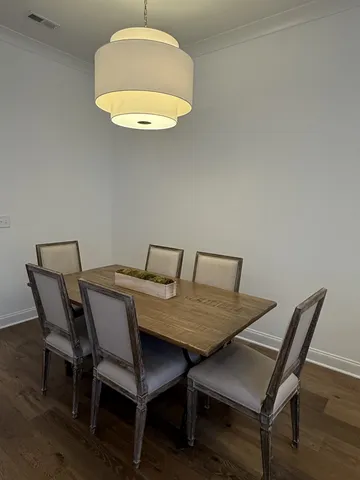 a bedroom with bed and a chandelier