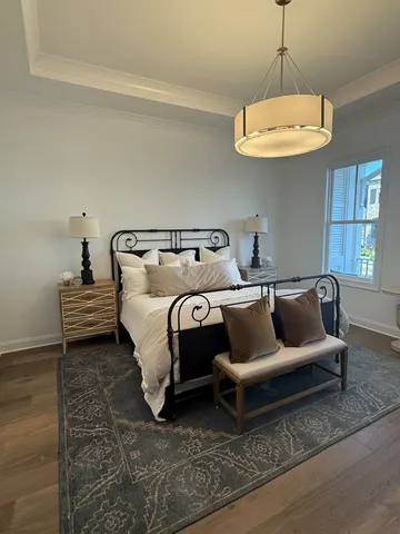 a bedroom with bed and window