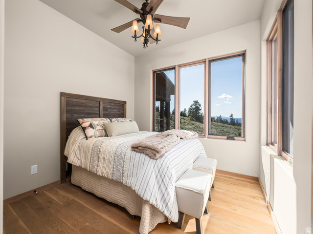 22677 East Snowbird Drive, Unit 47 Helper, UT 84526 - Photo 23 of 43 Bedroom featuring wood finished floors and a ceiling fan