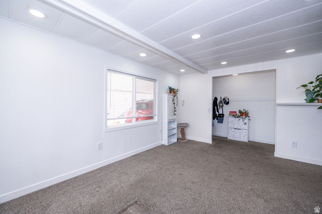 2600 North Hill Field Road, Unit 5 Layton, UT 84041 - Photo 7 of 33 Bright interior space featuring recessed lighting, a window with white trim, and neutral carpeting