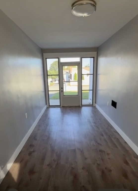 29 Tylee Avenue Worcester, MA 01605 - Photo 13 of 13 an empty room with wooden floor and windows