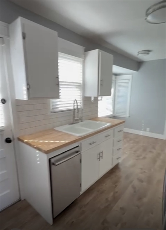 29 Tylee Avenue Worcester, MA 01605 - Photo 4 of 13 a kitchen with a sink stove and cabinets