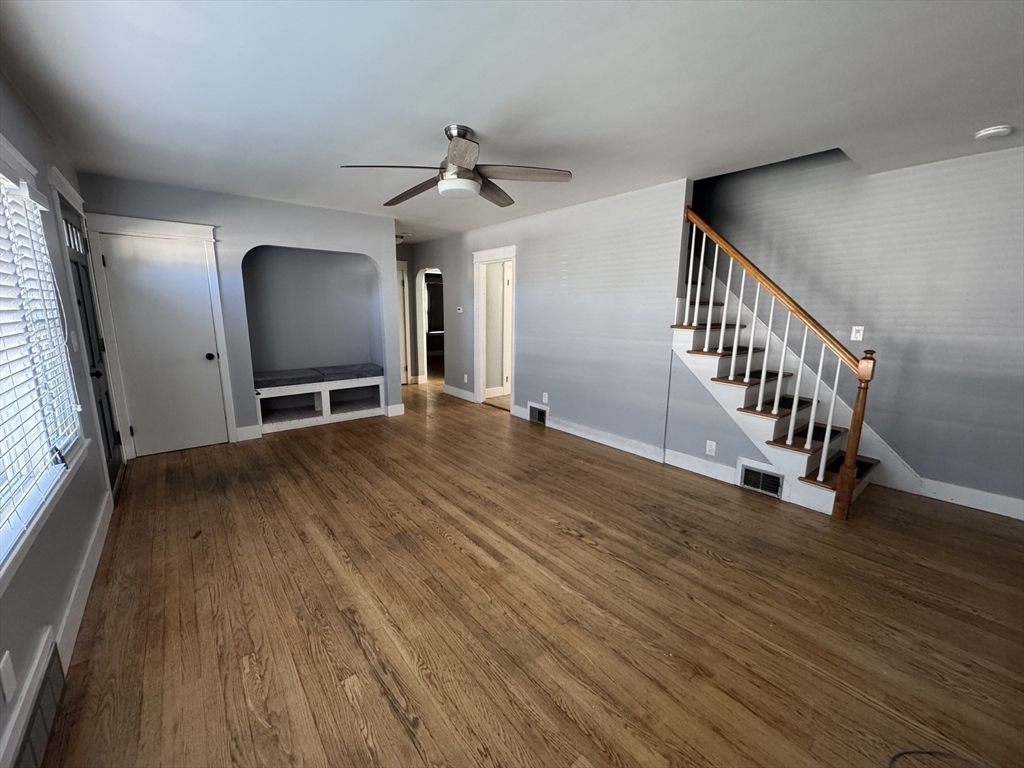 29 Tylee Avenue Worcester, MA 01605 - Photo 6 of 13 a view of an empty room with wooden floor and a window