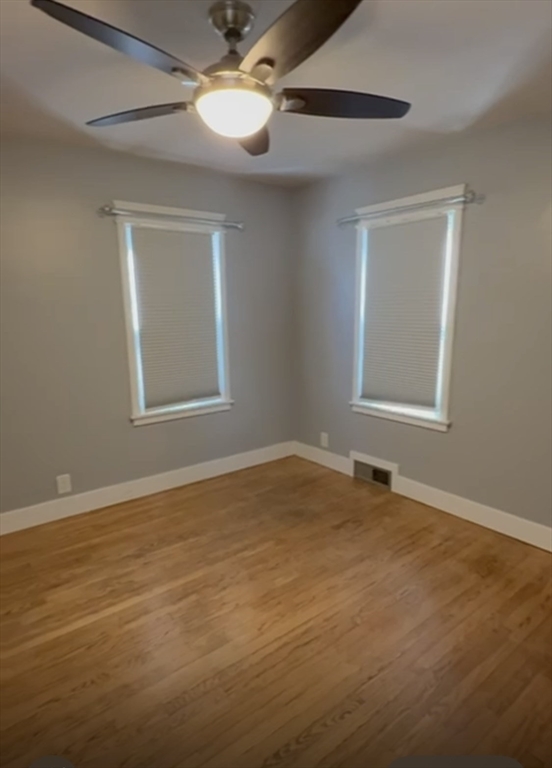 29 Tylee Avenue Worcester, MA 01605 - Photo 9 of 13 an empty room with windows and fan