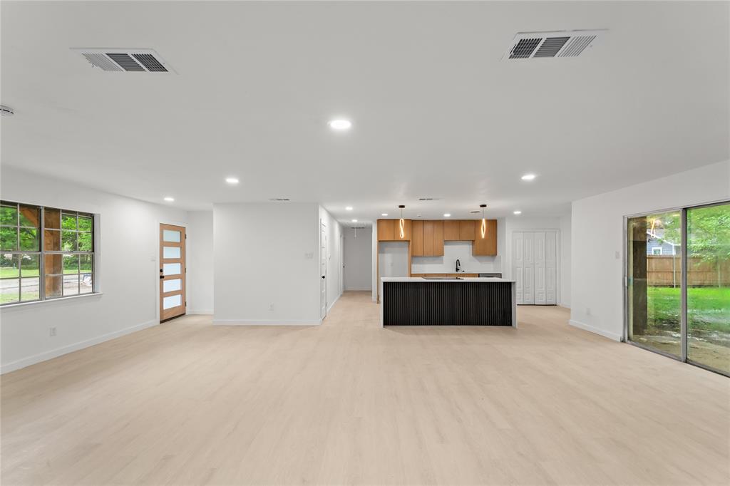 110 Hackberry Street Lancaster, TX 75146 - Photo 4 of 32 Open-concept living space featuring light wood-finish flooring and recessed lighting