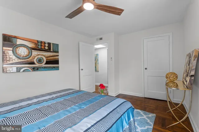 a bedroom with a bed and a cabinets