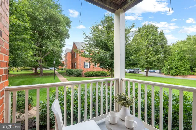 a view of a wooden deck next to a yard