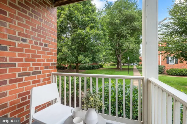 a view of a balcony with wooden floor
