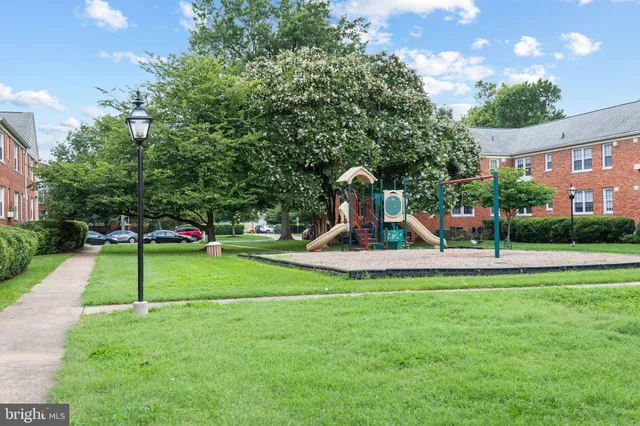 a front view of a building with garden