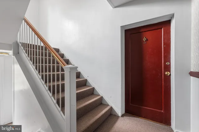 a view of a hallway with front door