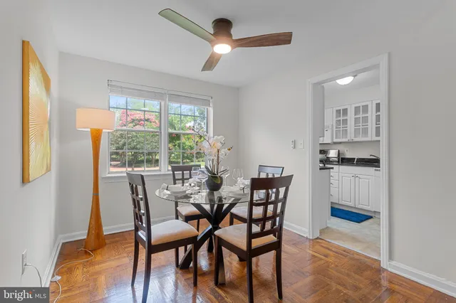 a dining room with furniture and window