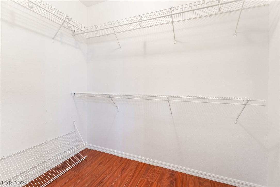 5389 Progresso Street Las Vegas, NV 89135 - Photo 22 of 41 Ample wire shelving and rich wood flooring define this practical closet space.