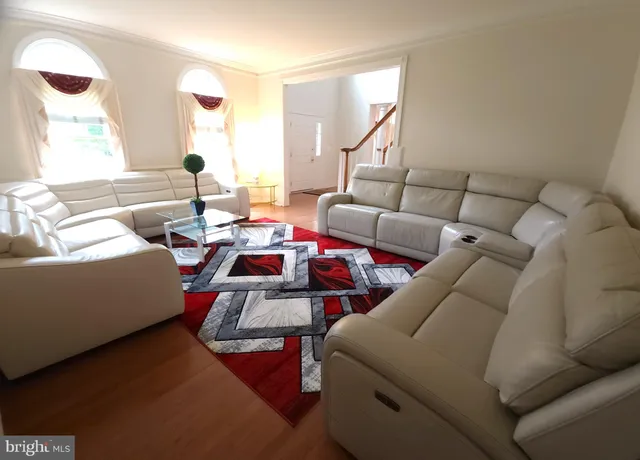 a living room with furniture and white walls