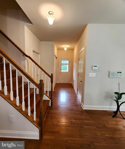 a view of entryway with wooden floor