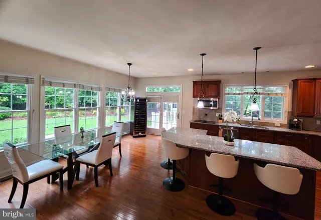 a kitchen with a stove a sink and a microwave