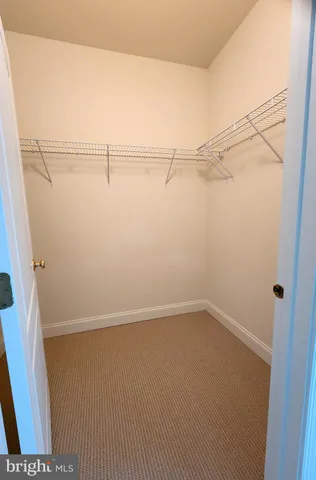 a room with a bed and a cabinets