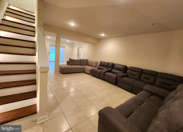 a living room with furniture and a rug