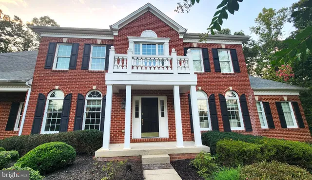 a front view of residential houses with yard
