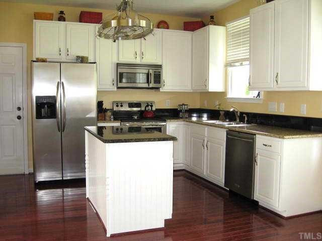1603 Patterson Grove Road Apex, NC 27502 - Photo 5 of 12 Updated kitchen with new granite counters, stainless steel appliances, & hardwood floor; includes nice breakfast nook Kitchen