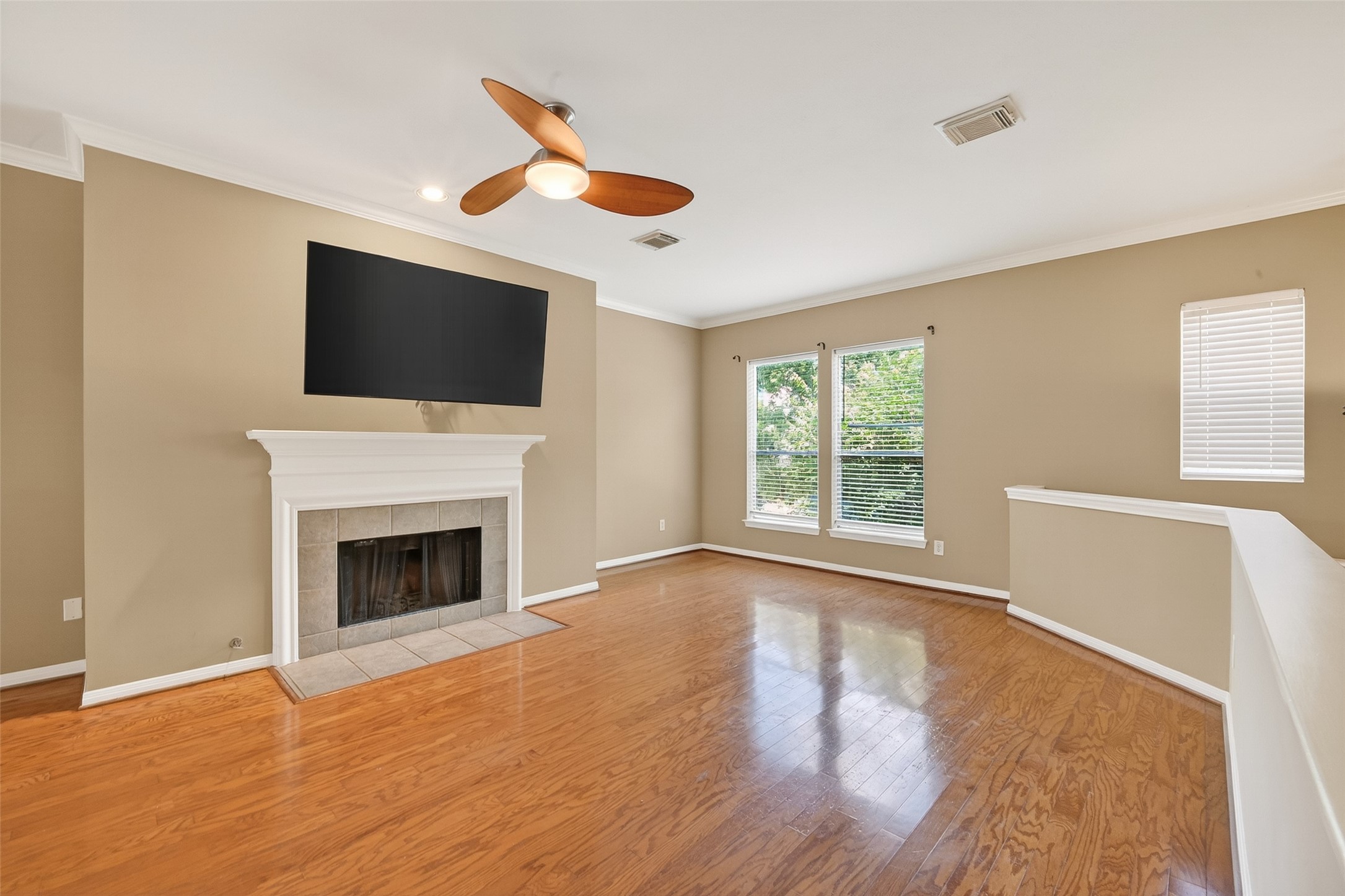 2804 Chenevert Street Houston, TX 77004 - Photo 19 of 37 a living room with a flat screen tv and a fireplace