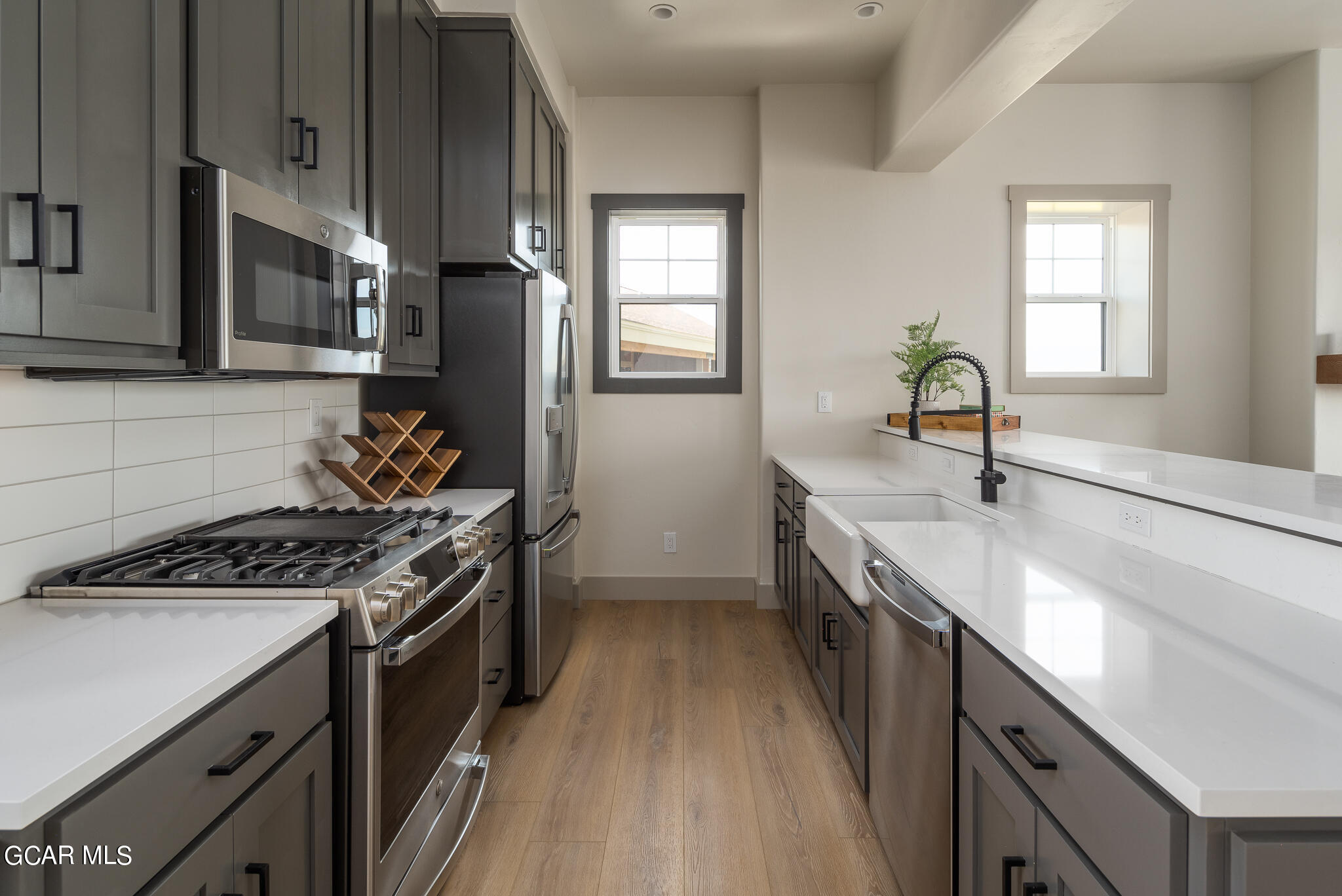 223 Eagle Ridge Circle Granby, CO 80446 - Photo 13 of 41 a kitchen with stainless steel appliances granite countertop a sink stove and refrigerator