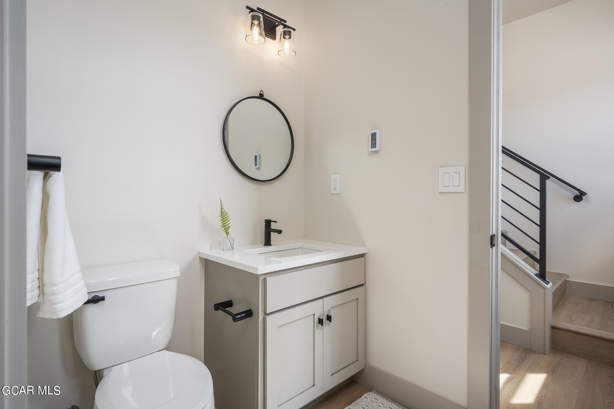 223 Eagle Ridge Circle Granby, CO 80446 - Photo 19 of 41 a bathroom with a toilet sink and mirror