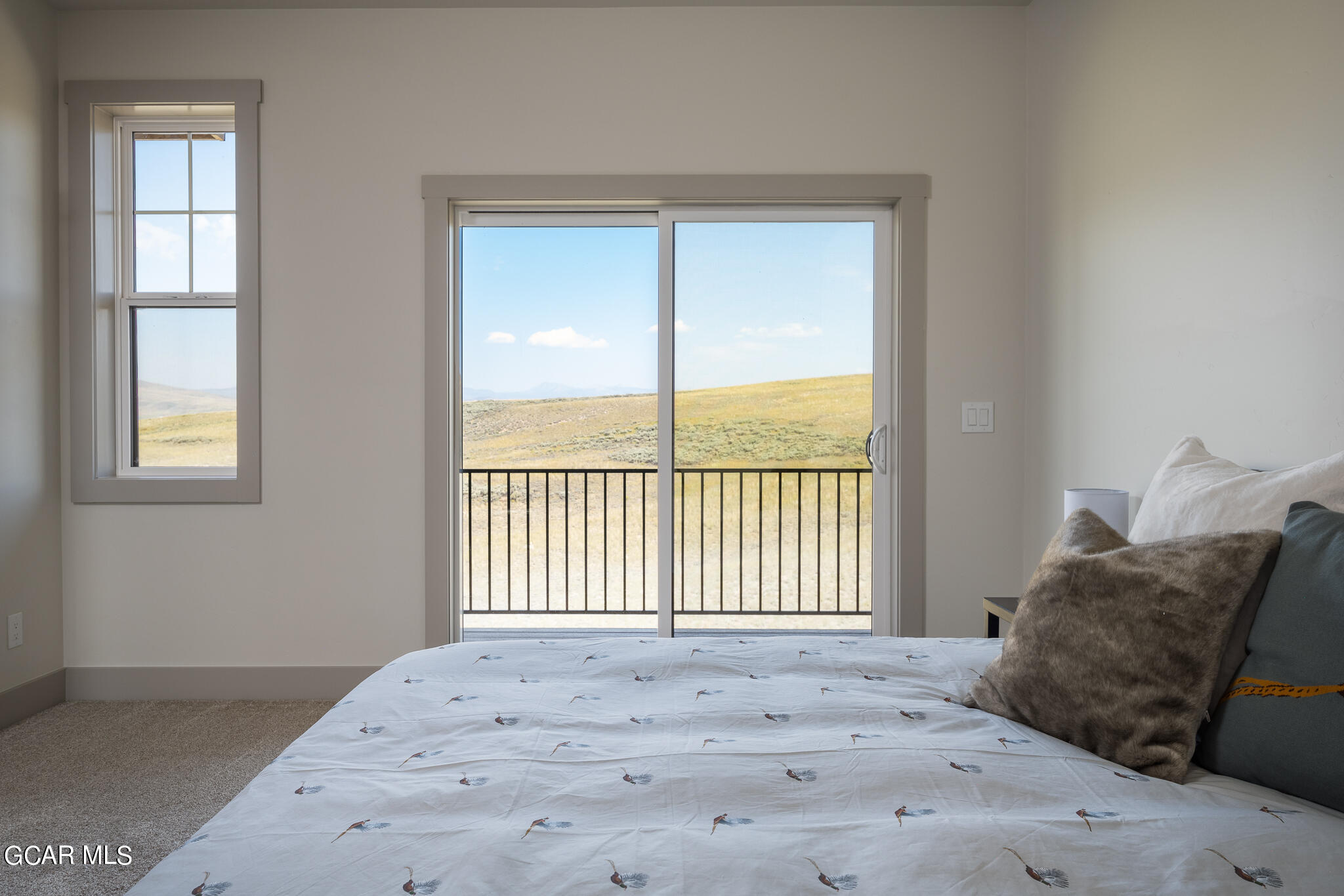 223 Eagle Ridge Circle Granby, CO 80446 - Photo 27 of 41 a view of a bedroom with a bed and a window