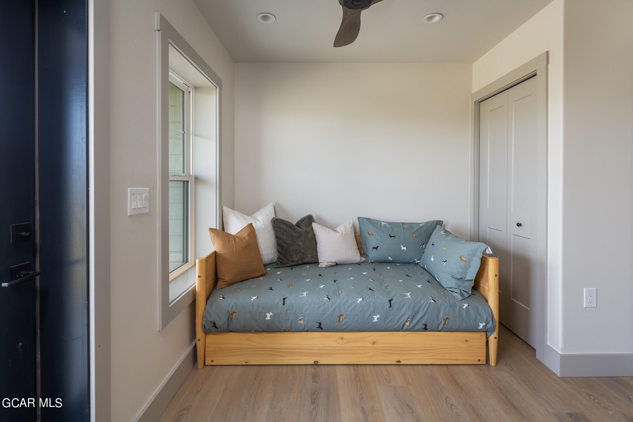 223 Eagle Ridge Circle Granby, CO 80446 - Photo 31 of 41 a large bed sitting in a bedroom next to a cabinet