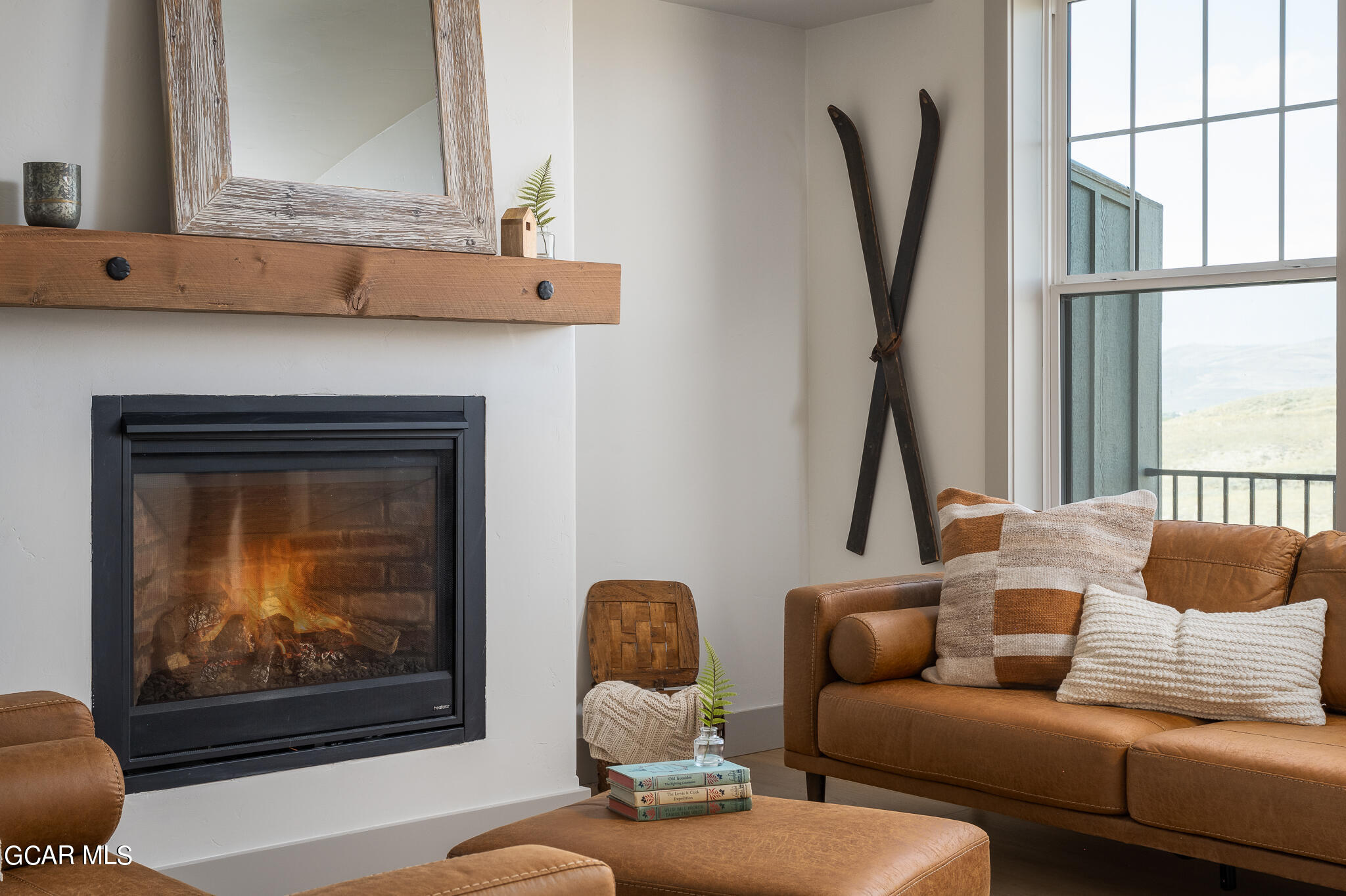 223 Eagle Ridge Circle Granby, CO 80446 - Photo 4 of 41 a living room with furniture and a fireplace