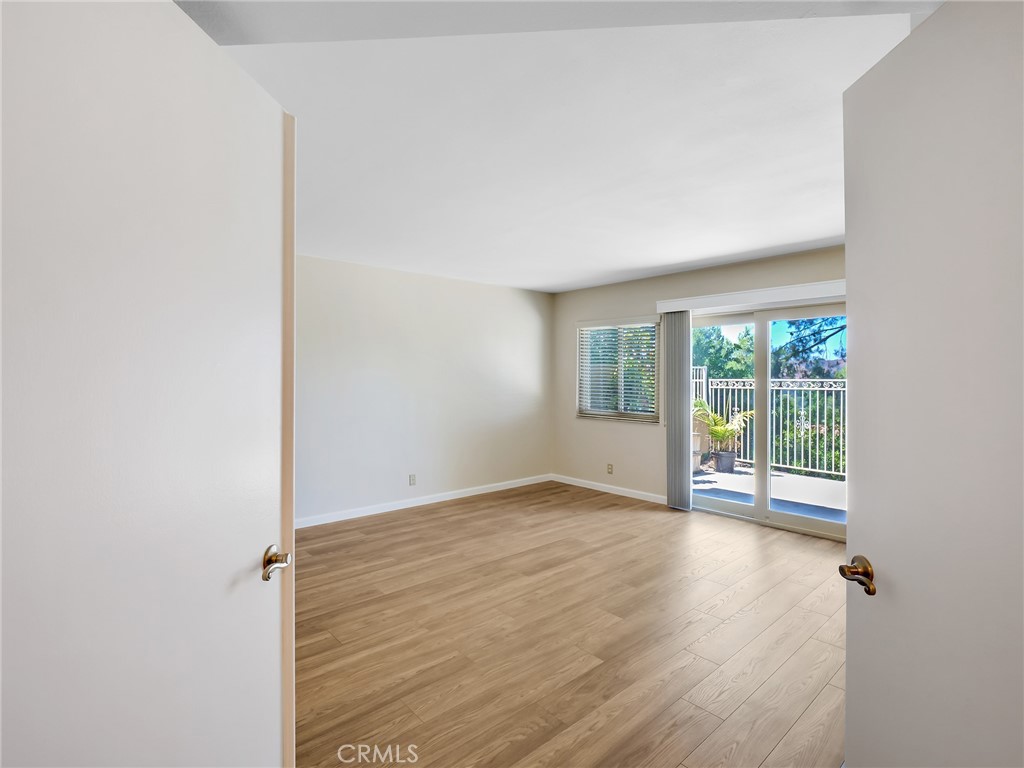 2910 Malaga Circle, Unit A Diamond Bar, CA 91765 - Photo 24 of 52 an empty room with wooden floor and windows