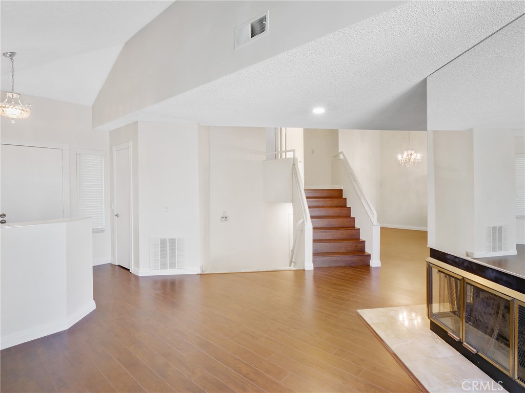 2910 Malaga Circle, Unit A Diamond Bar, CA 91765 - Photo 7 of 52 a view of hallway with stairs and wooden floor