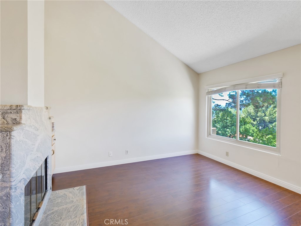 2910 Malaga Circle, Unit A Diamond Bar, CA 91765 - Photo 10 of 52 an empty room with wooden floor and windows