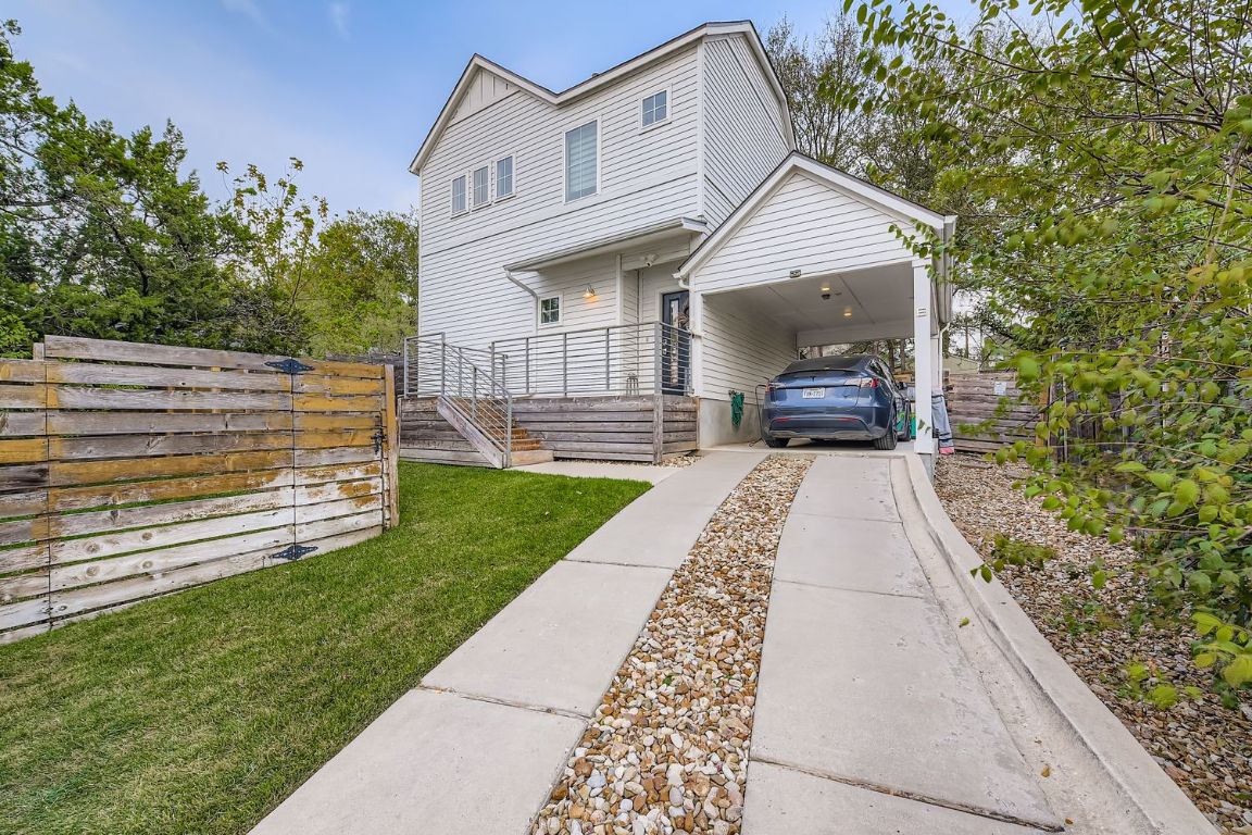1213 Eleanor Street, Unit B Austin, TX 78721 - Photo 1 of 17 a front view of a house with a yard