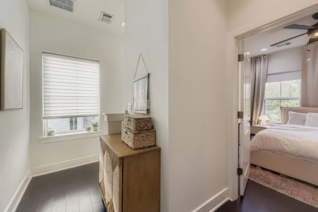 a bedroom with bed and a window