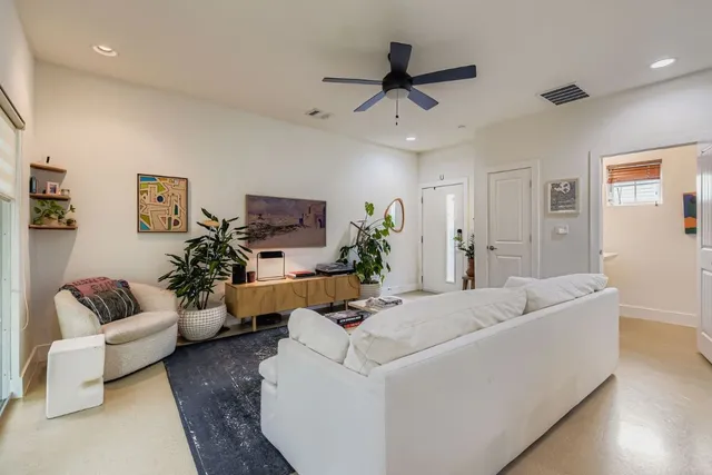 a living room with furniture and a couch
