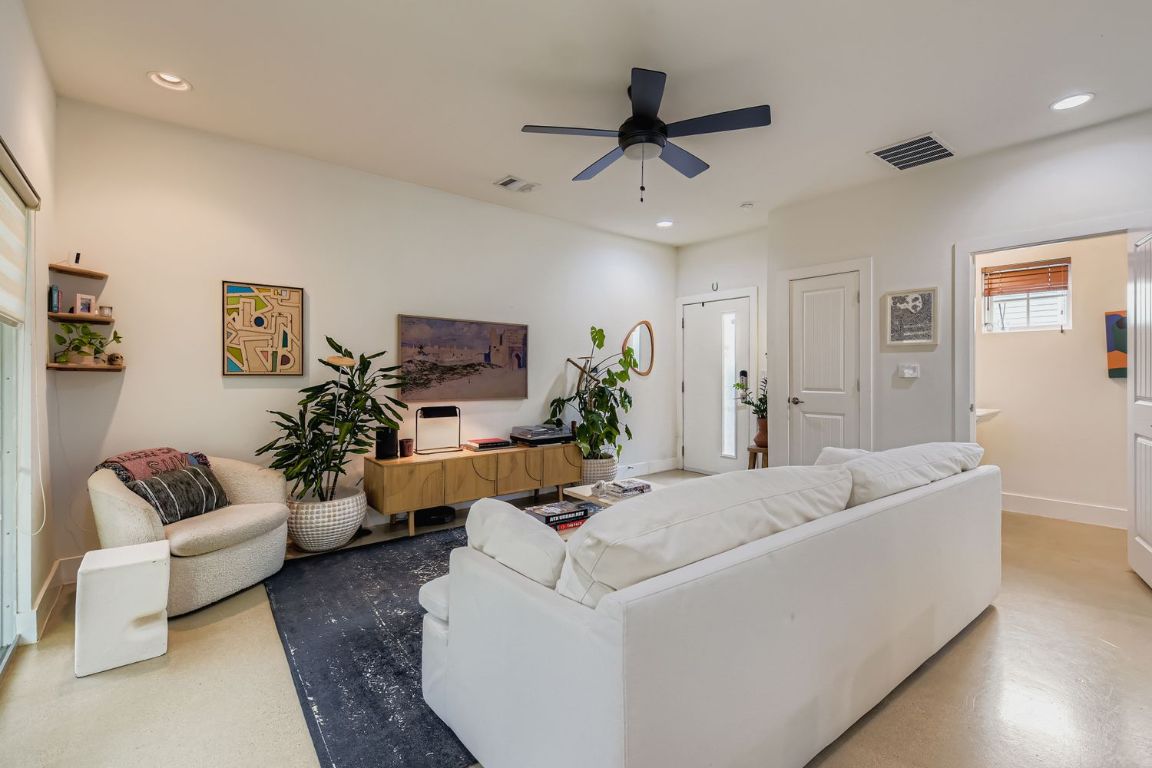 1213 Eleanor Street, Unit B Austin, TX 78721 - Photo 4 of 17 a living room with furniture and a couch