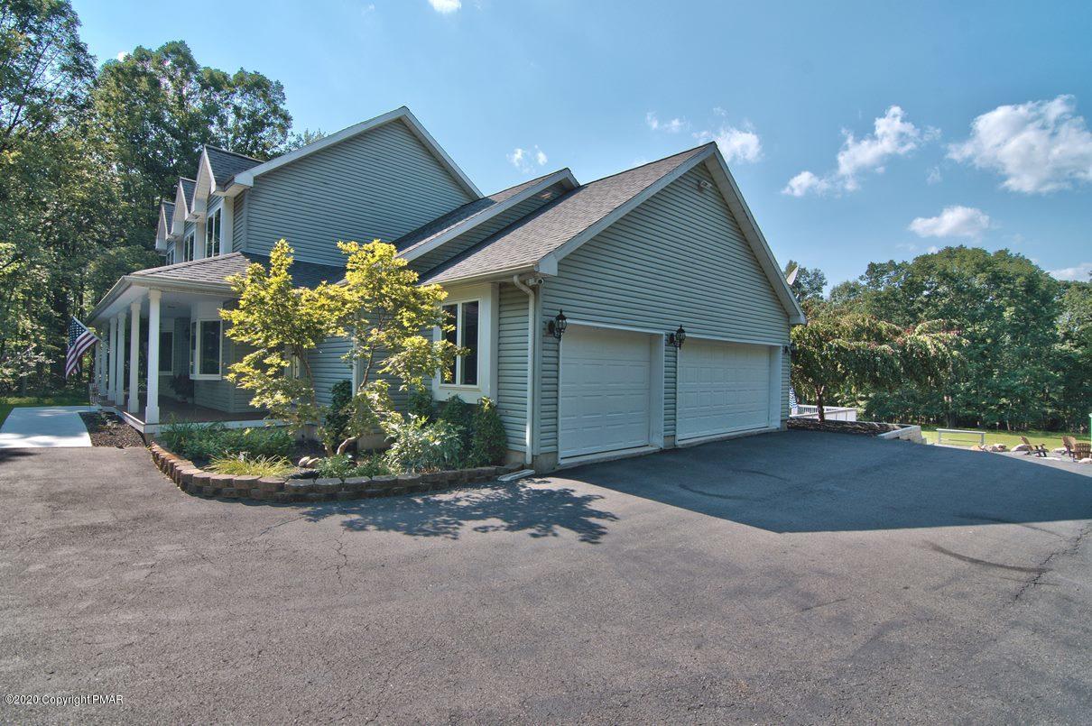 659 Behrens Road Jim Thorpe, PA 18229 - Photo 114 of 116 a view of a house with a small yard and a garage
