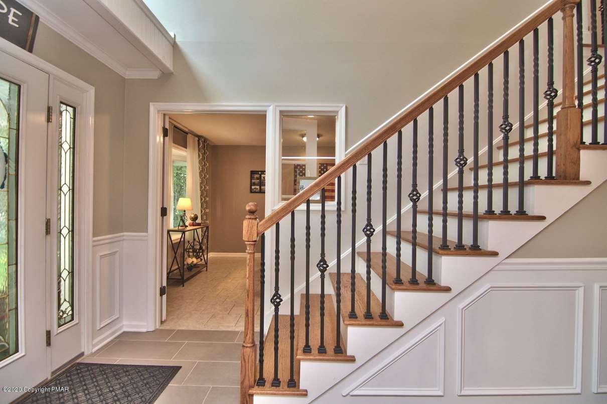 659 Behrens Road Jim Thorpe, PA 18229 - Photo 13 of 116 a view of staircase with lots of frames on wall and a window