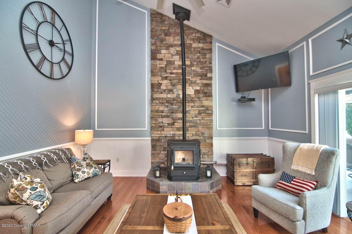 659 Behrens Road Jim Thorpe, PA 18229 - Photo 24 of 116 a living room with furniture and a fireplace