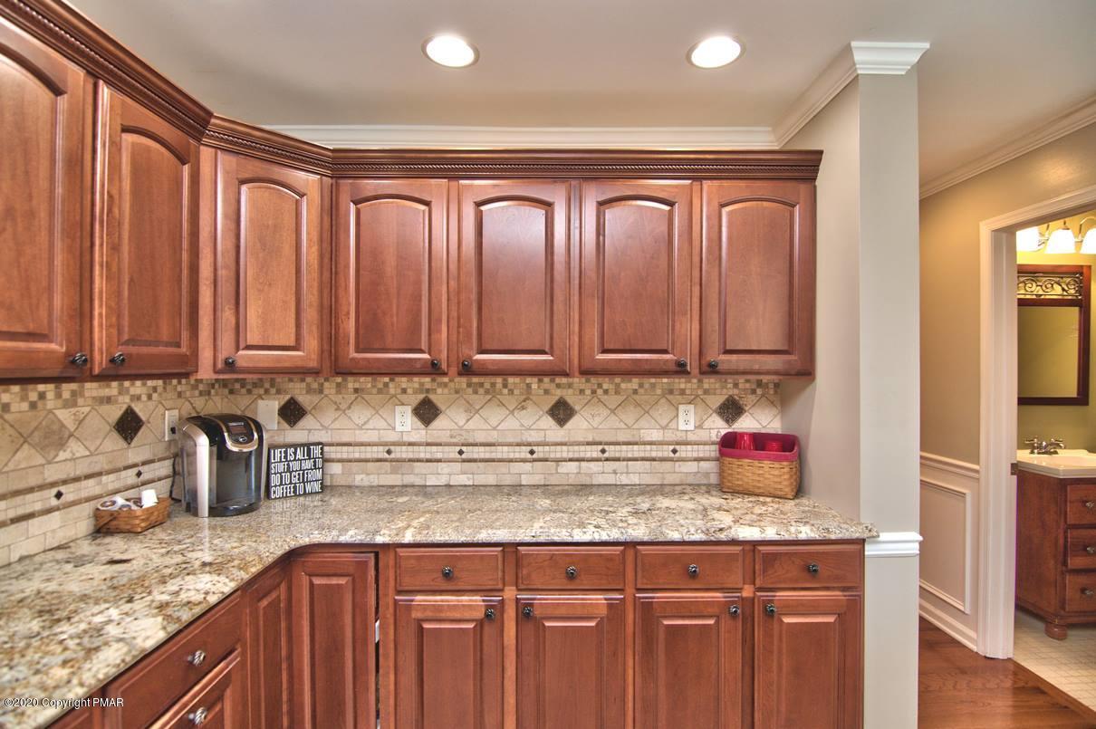 659 Behrens Road Jim Thorpe, PA 18229 - Photo 38 of 116 a kitchen with granite countertop stainless steel appliances a sink and cabinets