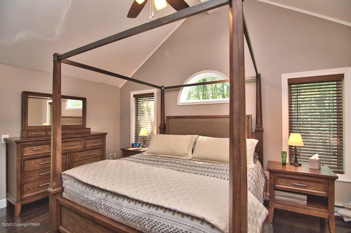 659 Behrens Road Jim Thorpe, PA 18229 - Photo 39 of 116 a bedroom with a bed and large windows