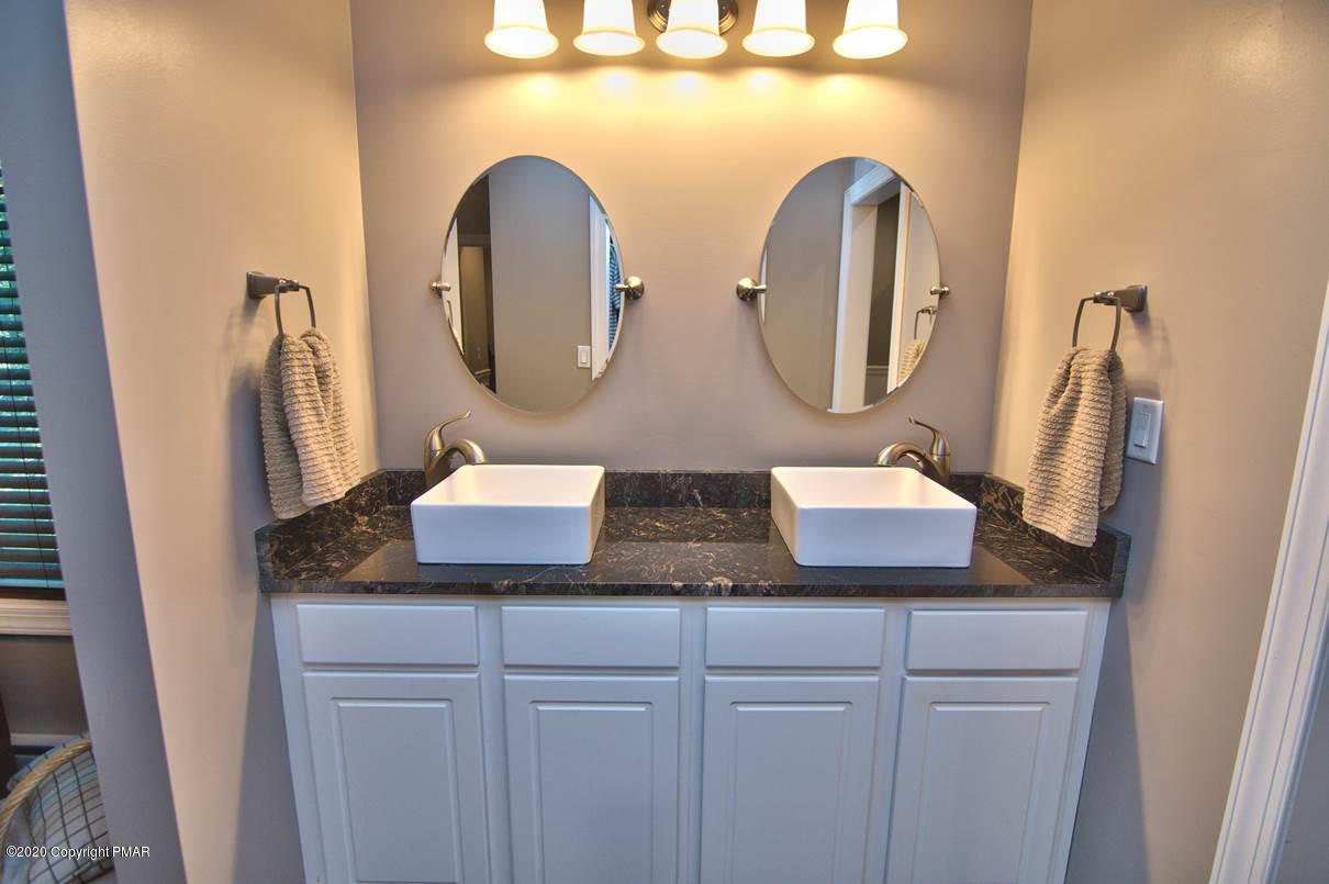 659 Behrens Road Jim Thorpe, PA 18229 - Photo 44 of 116 a bathroom with a granite countertop double vanity sink and mirror