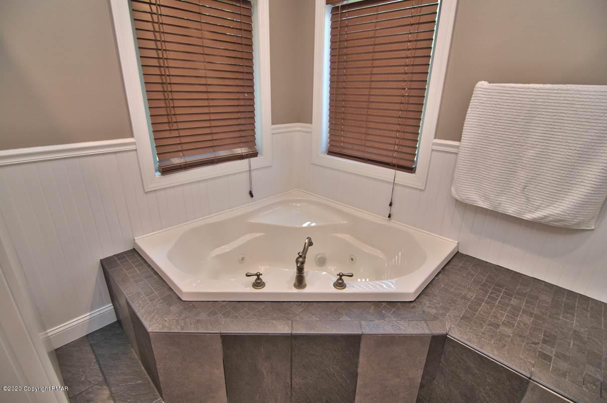 659 Behrens Road Jim Thorpe, PA 18229 - Photo 45 of 116 a bathroom with a bathtub and a window
